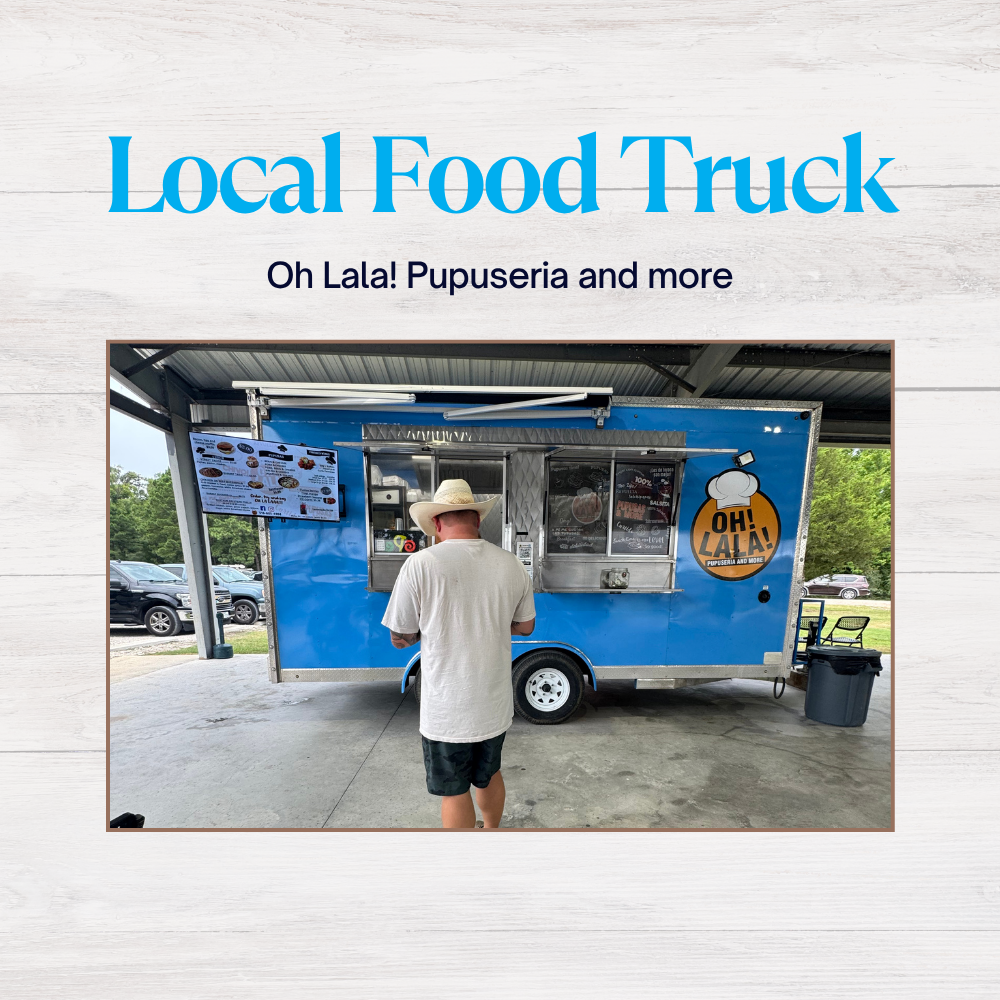 Man ordering at a vibrant blue food truck, Oh Lala! Pupuseria, under a shaded area with menu displayed.