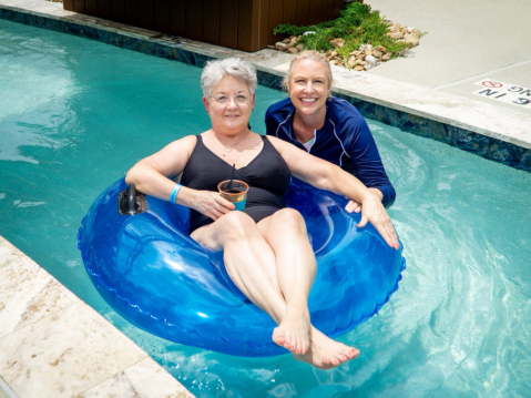 Guests floating in the lazy river | two creeks crossing resort guests floating in the lazy river