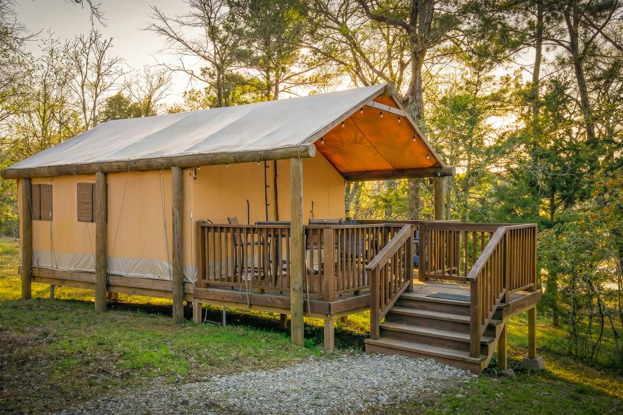 Safari-style glamping tent on a wooden deck at Two Creeks Crossing Resort near Lake Livingston